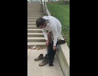 Man take off jeans white ripped jeans