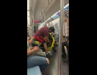Man sitting on his yellow vespa in train
