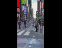 Woman in violet dress poses on the bike lane