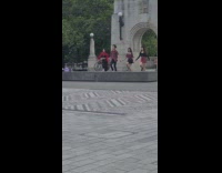 Guy three girls dance choreography park arch 