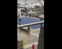 Woman black jacket tiktok dance video shoot park