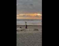 Man hat shirtless green shorts dance beach