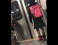 two kids kicking each other on train