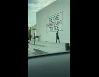 Guy dances in front of white wall
