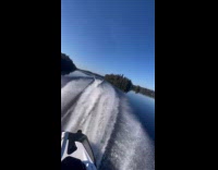 Man driving jet at still waters 
