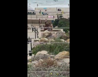 Two girls dance jump stairs beach video