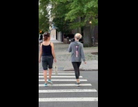 Woman walks around with pigeon on shoulder