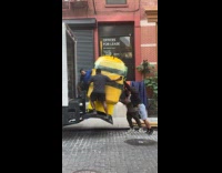Men load despicable me minion statue on truck part 1