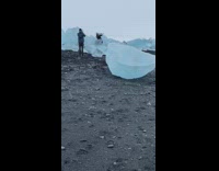 girl holds ice up hand icebergs 