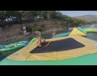 Man Backflips on his Head on Water Trampoline 