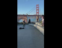 Guy black shirt dance golden gate bridge