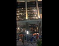 People chant as they leave the stadium