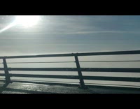 Car drive on bridge fog over water
