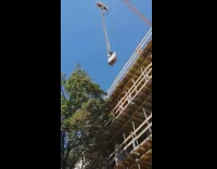 Construction workers use crane lift mcdonalds bag