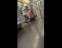 Guy takes photos of a woman on subway