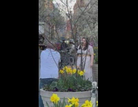 Woman singing in the street while an old man yells