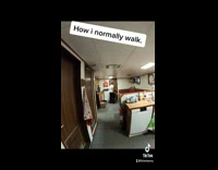 Guy walks inside of boat side ways