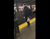Guy throws bag of chips at incoming subway train and bag 