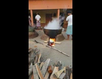 Man stir large pot create tornado smoke