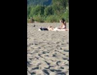 Girl attempt bottle flip on friend back