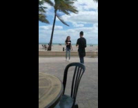 Blonde girl dance sing to music beach