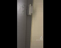 Woman doesnt know how to use a door latch