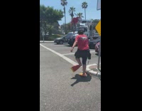 Collab Kook Of The Day - Red shirt guy crosses street orange flippers 