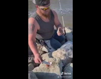 Guy sniffs fish needs to call her 