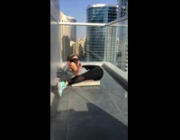 Girl does sit ups while doing splits 