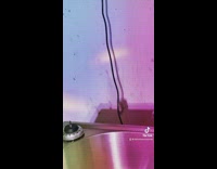 Rat hanging on electrical cord dropping behind sink