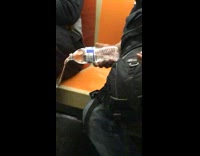 guy falling asleep spills water on guy sitting next to him