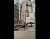 Orange jacket guy catches pigeon bird 
