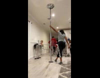 Woman pole dances then pole fell down