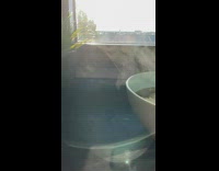 Sunlight hit steam from hot noodles slow motion