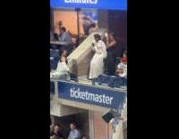 Two women upper box tennis match photoshoot