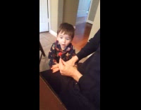 Toddler amused when candle gets blown out 