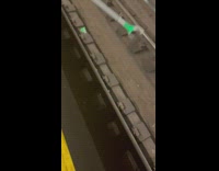 Guy uses long stick to grab dropped hat 