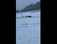Green pants guy falls off sled fail 