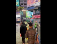 Man white jacket dances outside the street