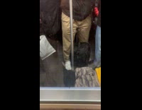 Man yellow hoodie lay on train seat