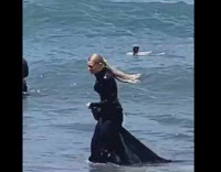Woman long black dress in ocean picture