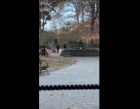 Woman headphones red skirt dance tiktok park