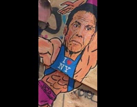 Street Art of Feminine Cuomo  on Wooden Wall 