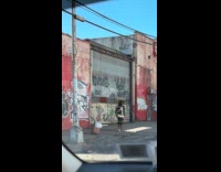 Man black bonnet dance on the sidewalk