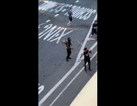 Guy black cowboy hat wings dances street