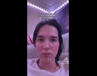 Girl shows freckle on foot 