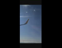 Jet plane wings blocks out the sun