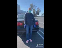 Family in car trunk face masks