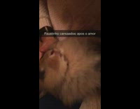 Brown rabbit laying on back in girls lap being pet snapchat text