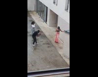 Lady in Pink Gown Stands for Photoshoot 